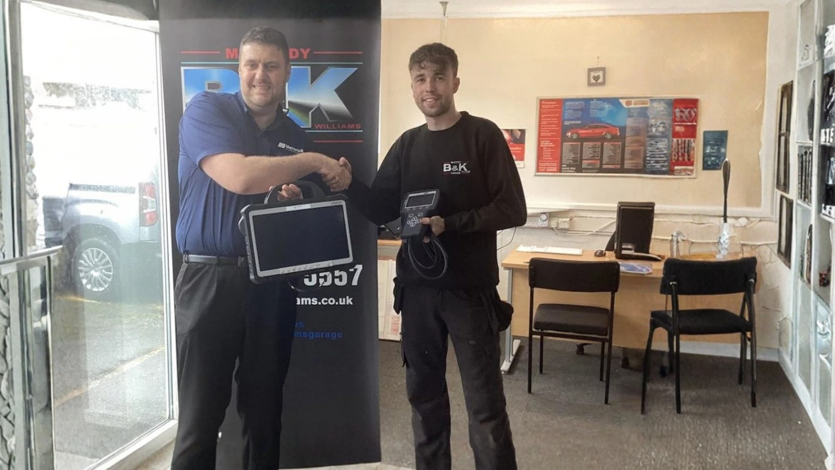 Huw Elis Williams and Matt with OEM diagnostic equipment